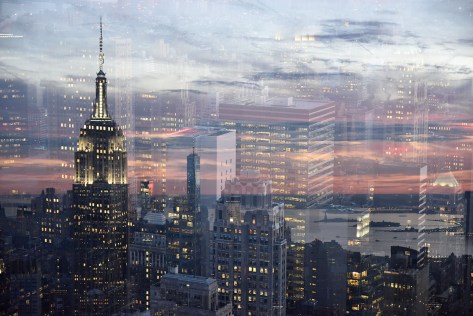 Double exposure photo of the Empire State Building and the One World Trade Center.