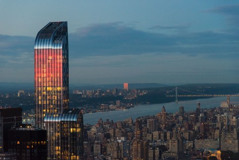 Photo of the One57 building. Red from the reflected sunset.
