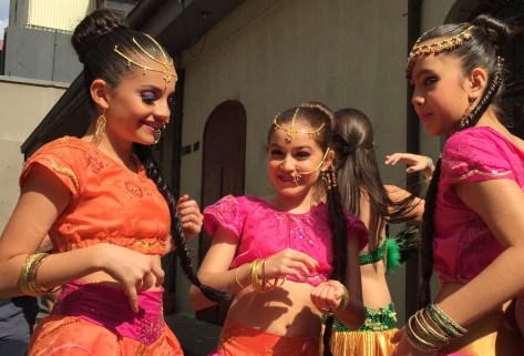 Photo of a group of Dancers backstage chatting before their show.
