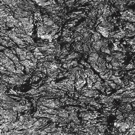 Image of a creek showing sunlight reflections. Photo by Eduardo Libby