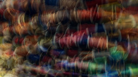 Multiple exposure image of ribbons at the Beads Shop. Photo by Eduardo Libby