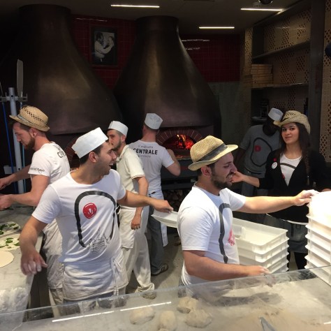 Image of Italian pizza makers having fun at Florence's Market. Photo by Eduardo Libby.