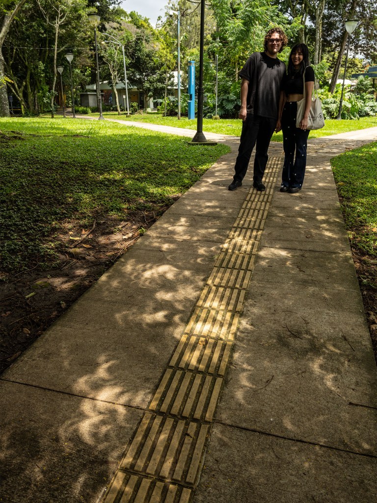 A couple that was watching the crescent-like images on the sidewalk.